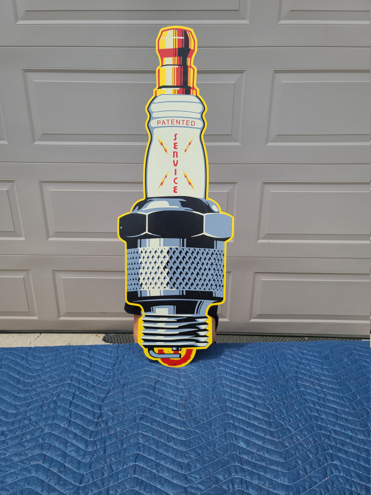 M147 Spark Plug Metal Sign MAG Auctions
